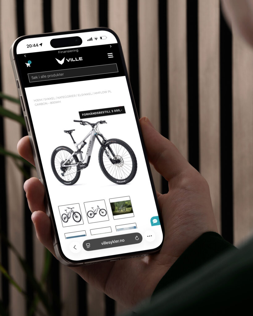 Close up av en iPhone som viser landingssiden til en elsykkel hos villesyker.no