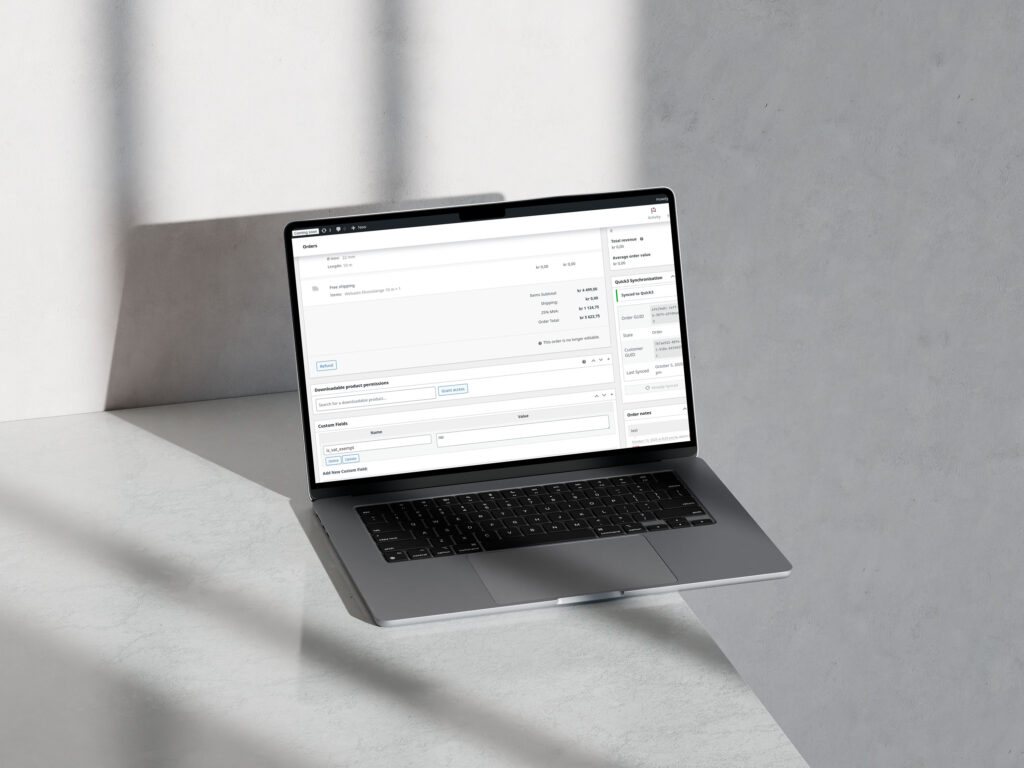 Laptop som viser quick 3 og woocommerce